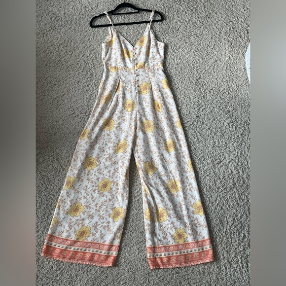 Forever 21 Pants - Forever 21 off-white & yellow floral spaghetti strap jumpsuit Women’s size S.